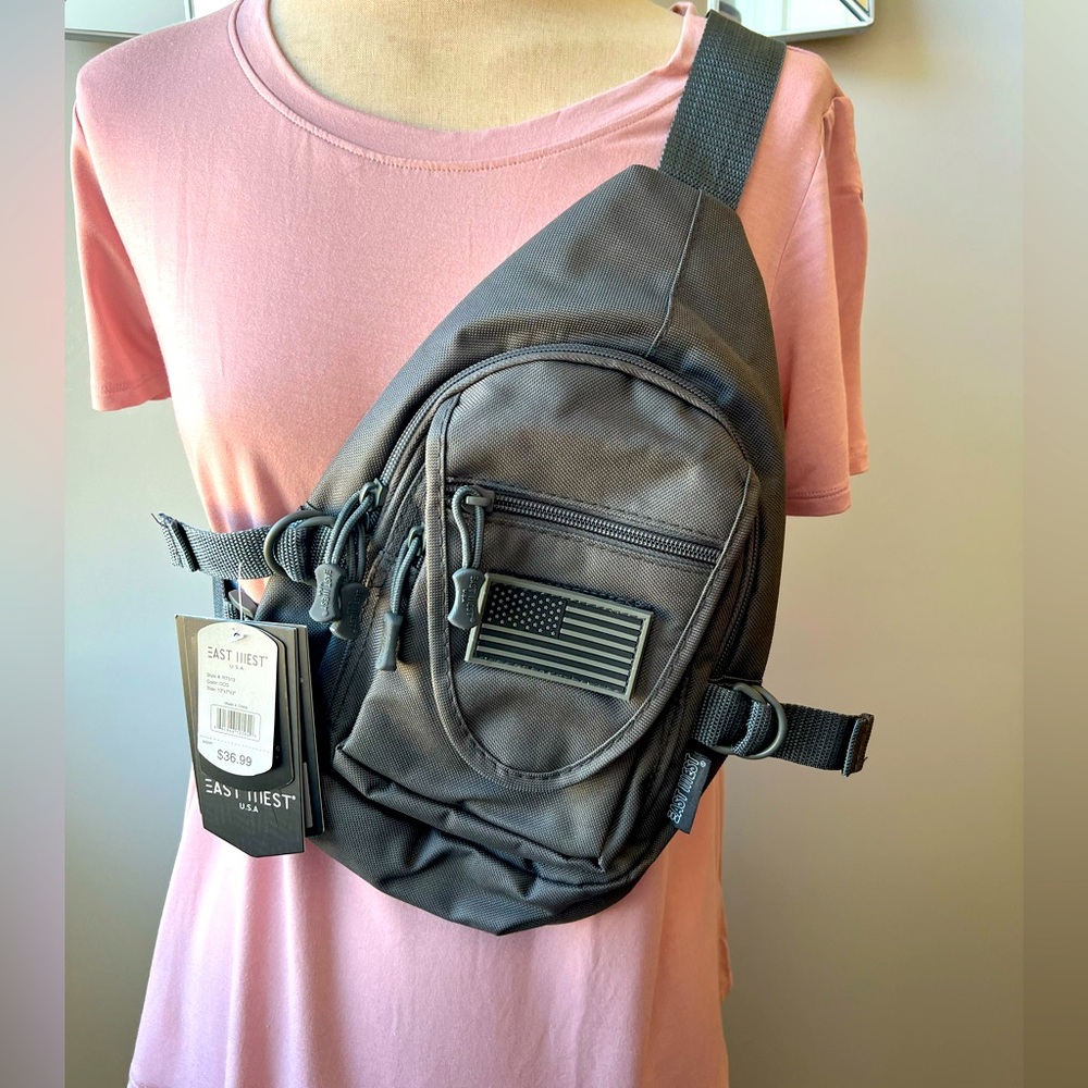 NWT East West Sling Utility Bag. This bag is great for an on the go person.